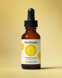 Mad Hippie Vitamin C Serum bottle on a yellow background
