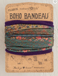 Boho bandeau with floral pattern and purple trim on a branded card.