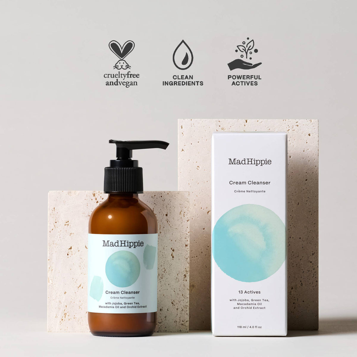 Mad Hippie Cream Cleanser bottle and packaging on a light gray background with brand icons.